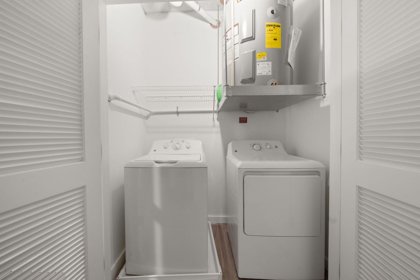 Washer and dryer in white room